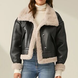 Black faux leather coat lined with Sherpa